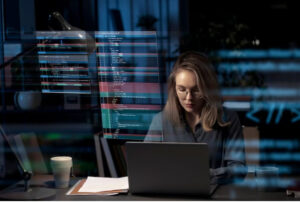 A picture of a person working with codes on a computer
