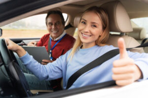 A picture of a woman and male driving instructor during driving test