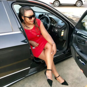 A picture of Betty Kyalo in a car