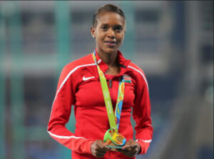 A picture of Faith Kipyegon holding a medal